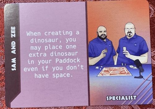 Dinosaur Island: Dice Tower – Sam and Zee Promo Card thumbnail